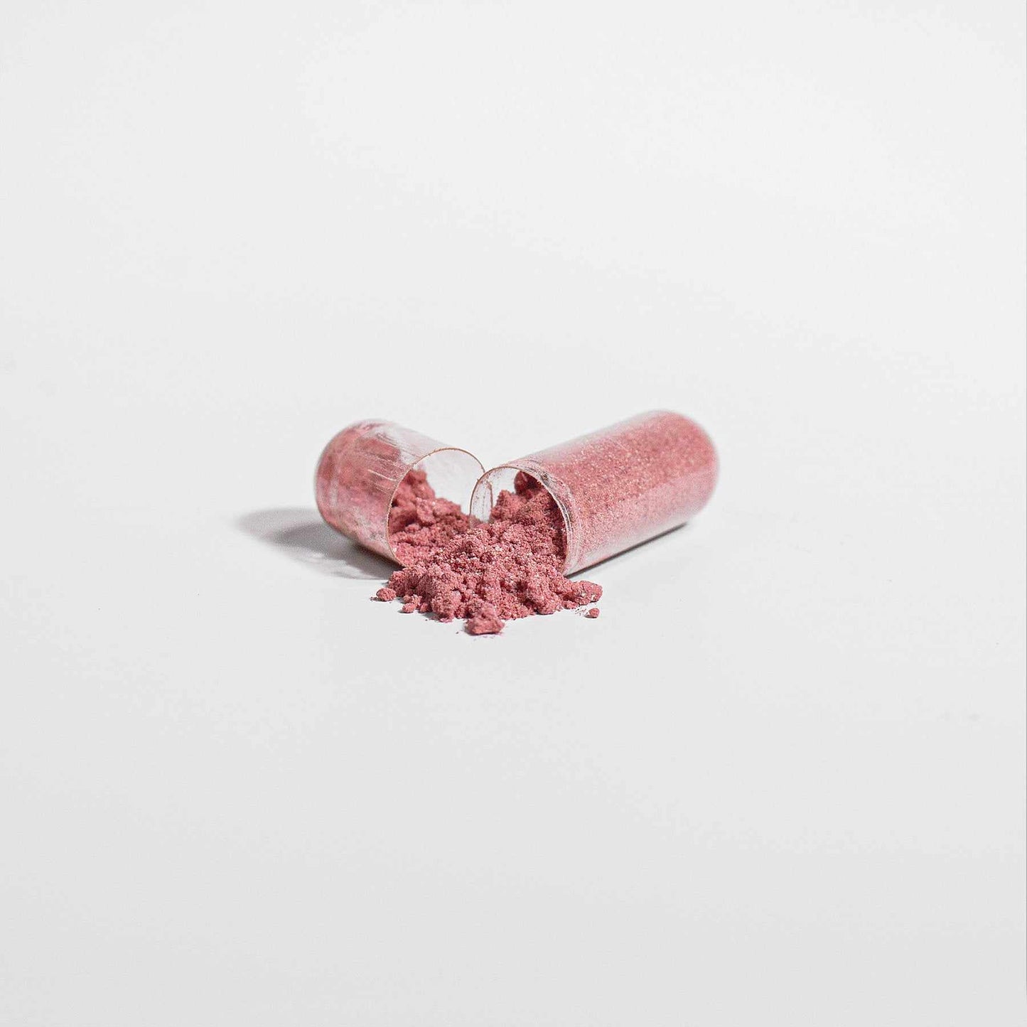 Organic Beetroot Powder Supplement capsule open with powder visible.