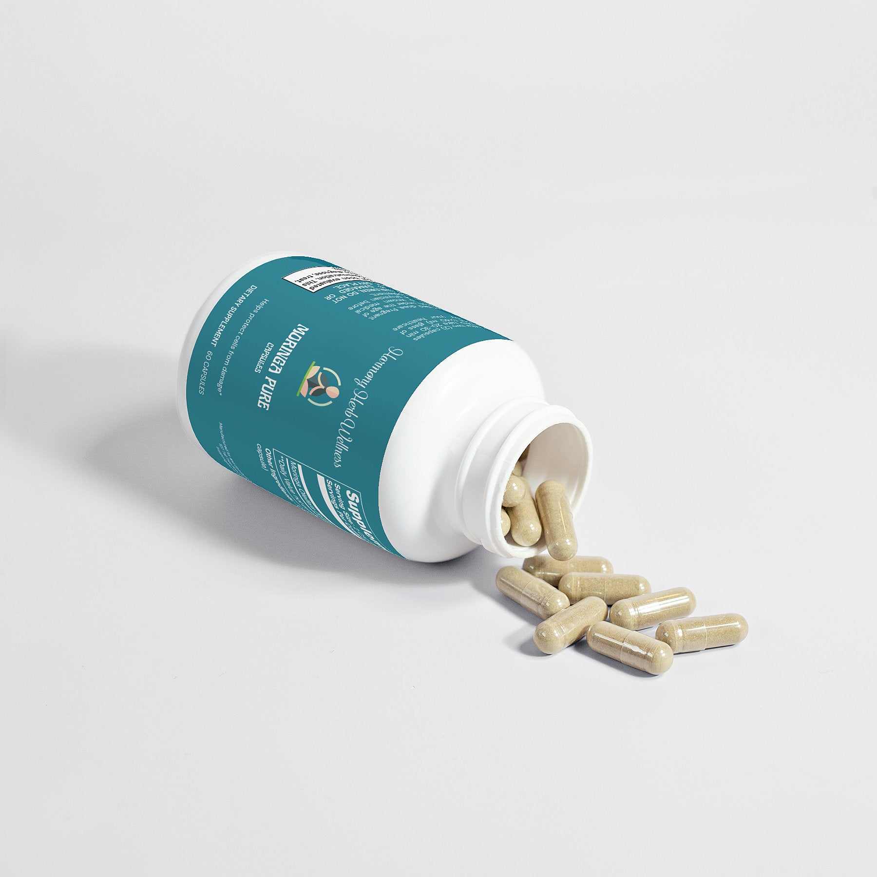 Moringa Pure supplement bottle with capsules spilling out.